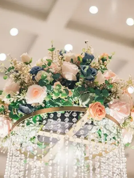 A hanging floral arrangement of trailing blooms and foliage