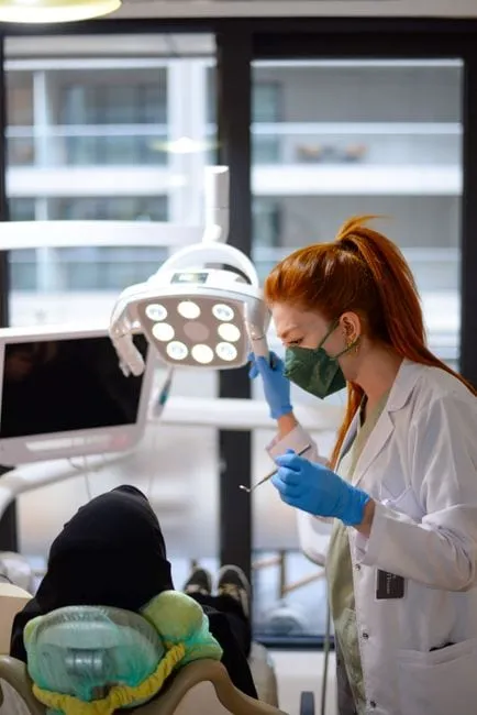A friendly dentist reassuring a patient during a gentle check-up