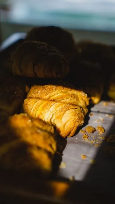 A golden, flaky butter croissant, freshly baked