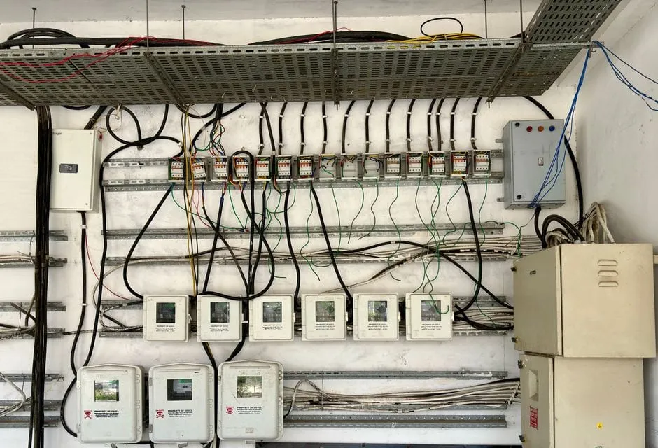 Close-up of a domestic consumer unit with neatly connected coloured wiring